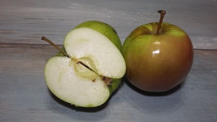 Apple on a blue background. Apple cut, apple slice