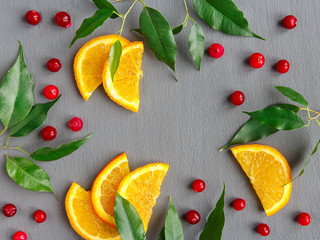 Fruit background design of citrus slices and cranberries. Fruit pattern.