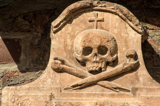 Stone skull. Medieval gothic relief of human skull on facade of Frauen church,Munich,Bavaria, Germany