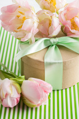 Pink purple tulips and gift box with green ribbon