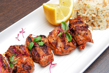 grilled meat dish of lamb pieces with garnish
