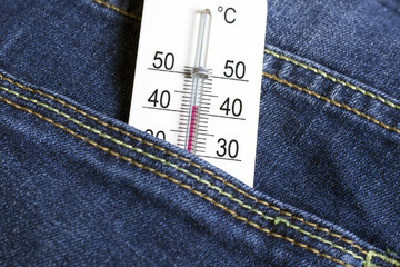 High temperature on a thermometer, jeans
