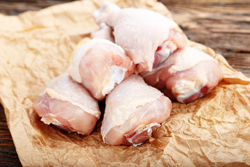 raw Chicken legs on  paper