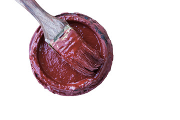 Isolated brush and cover with red paint on a white background