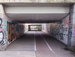 bicycle tunnel with many graffiti