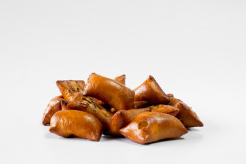 A portion of unsalted peanut butter pretzels on white background