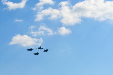 Naklejka na ściany i meble Flight of a aerobatic teams on military jet planes