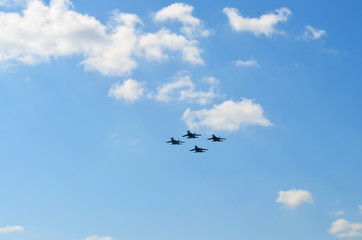 Flight of a aerobatic teams on military jet planes