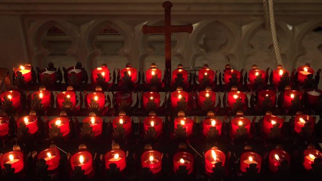 Prayer candles burning and crucifix in a Roman Catholic church in Savannah, Georgia