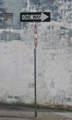 One Way Street Sign In Urban Neighborhood