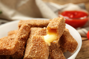 Tasty cheese sticks, closeup