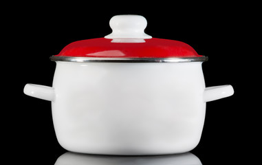 White saucepan, isolated on black background.