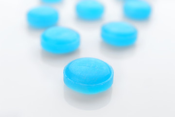 Cough drops on white background