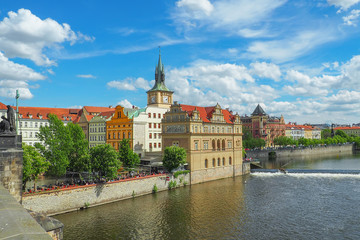 Prague cityscape from Charles Bridge on a sunny summer day.
