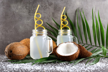 Beautiful composition with coconut water on table