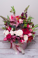 beautiful floral arrangement in a hat box