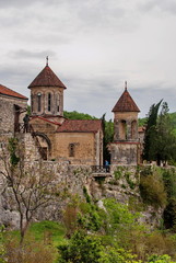Fototapeta na wymiar Motsameta Monastery - a small temple in the surrounding area of Kutaisi. It buried Martyrs David and Constantine. It located in a picturesque location on a cliff at the winding river.