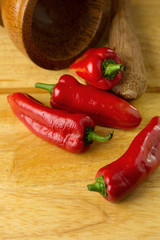 red hot chilli peppers on wooden background. Selective focus