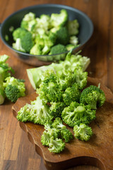 Healthy Green Organic Raw Broccoli Florets Ready for Cooking. Broccoli.Raw fresh broccoli on wooden table