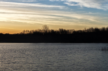 Sunrise over a lake near the Des Moines river