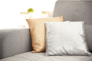 Shiny pillows with sequins on the couch