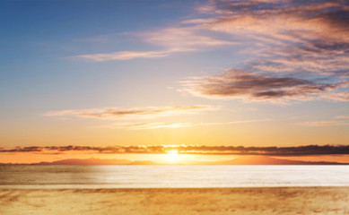 Wooden table top, with blur defocused sky in sunrise backgrounds