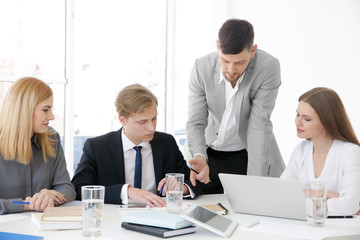 Business trainer giving presentation to group of people © Africa Studio