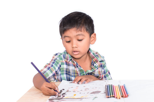 Cute little boy painting on book drawing