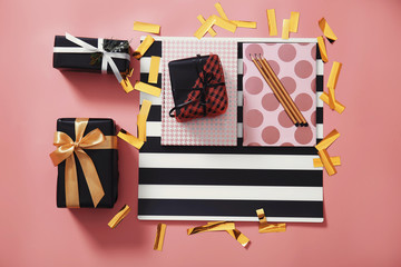Fototapeta premium Composition of stylish gift boxes and confetti on color background