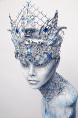 Mannequin in creative silver crown and collar