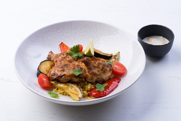 Fried chicken with vegetables on a white background
