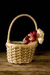 Fototapeta na wymiar Closeup basket on wooden table background