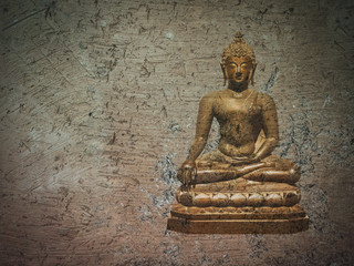 Golden buddha statue on brown crack earth