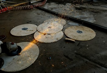 worker cutting metal plate for background