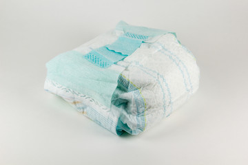 Full baby diaper on a white background