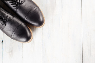 classic men's shoes on wood