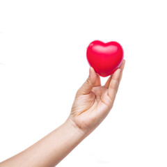 hand holding a red heart on white background