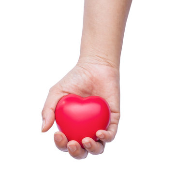 hand holding a red heart on white background