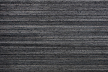 Texture of dark gray wood plank, used for background, wallpaper, interior or architecture.