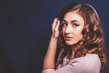 Brunette with ringlets and make-up closeup