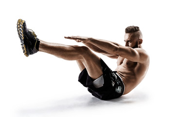Handsome young man doing fitness exercise. Photo of muscular man in silhouette on white background....