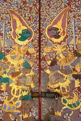 Old thai door architecture inside of  Wat Suthattepwararam temple.