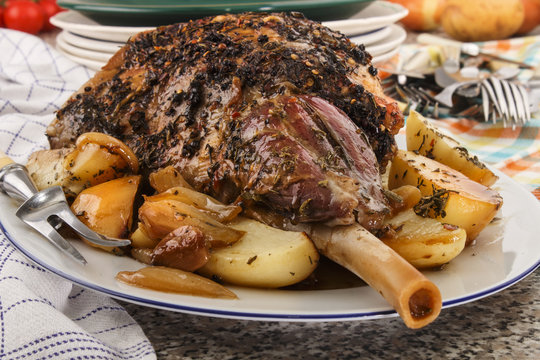 grilled leg of lamb with rosemary, potato and onion