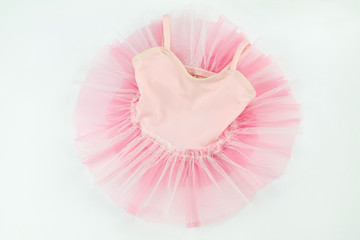 tender pink tutu for baby on white background - obrazy, fototapety, plakaty