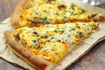 Pizza with chicken meat and mushrooms