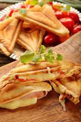 Fresh toast with cheese, ham and tomato