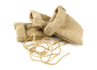 Hessian sack tied with string from low perspective isolated against white background