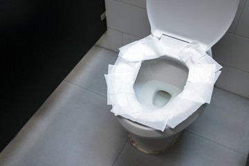 toilet paper put on OpenToilet seat.
Cover The Toilet Seat With Toilet Paper.
