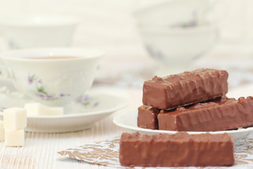 Tea and waffles with chocolate cream and nuts