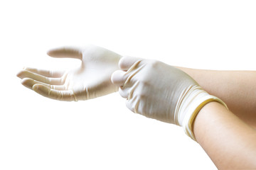 Doctor putting on sterile gloves isolated on white background